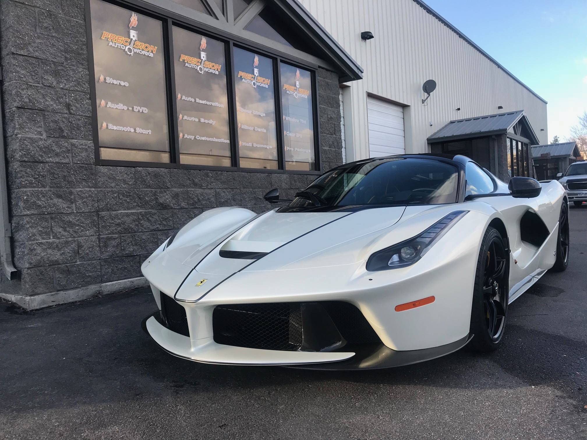 Hydrophobic ceramic coating repelling water on car hood